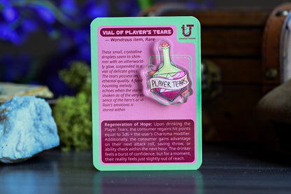 Card featuring a vial labeled 'Vial of Player's Tears' with text on a dark surface.